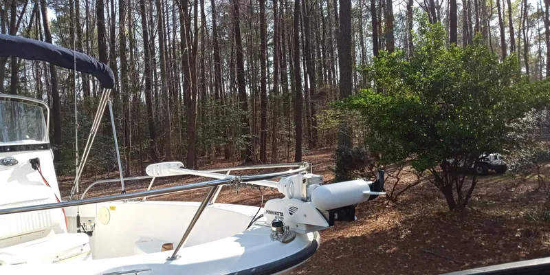 Slide: The Image of Boston Whaler 190 Nantucket 2003 boat parked in forest. - 5