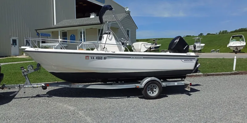 The Image of 2003 Boston Whaler 190 Nantucket on trailer in front of building. - 0