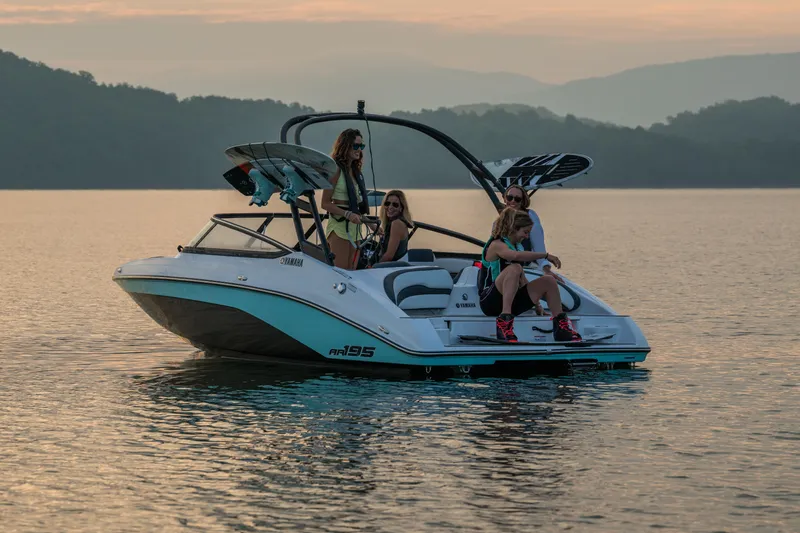 Slide: The Image of Manufacturer Provided Image: 2026 Yamaha AR195 boat with passengers enjoying a serene lake at sunset. - 4