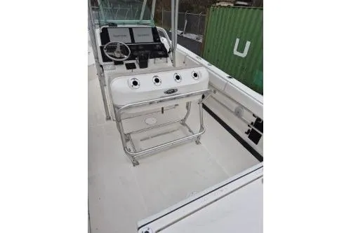 Slide: The Image of 2005 Robalo R260 Center Console boat interior with steering console and seating. - 13