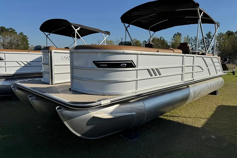 The Image of 2026 Bentley Pontoons Elite 253 Admiral pontoon boat with canopy, displayed outdoors. - 1