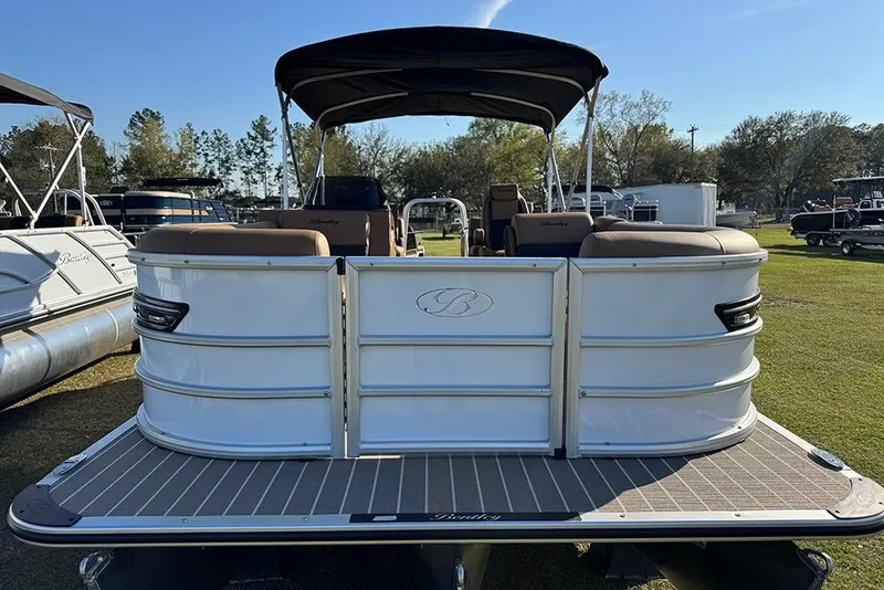 Slide: The Image of 2026 Bentley Pontoons Elite 253 Admiral pontoon boat displayed outdoors. - 10