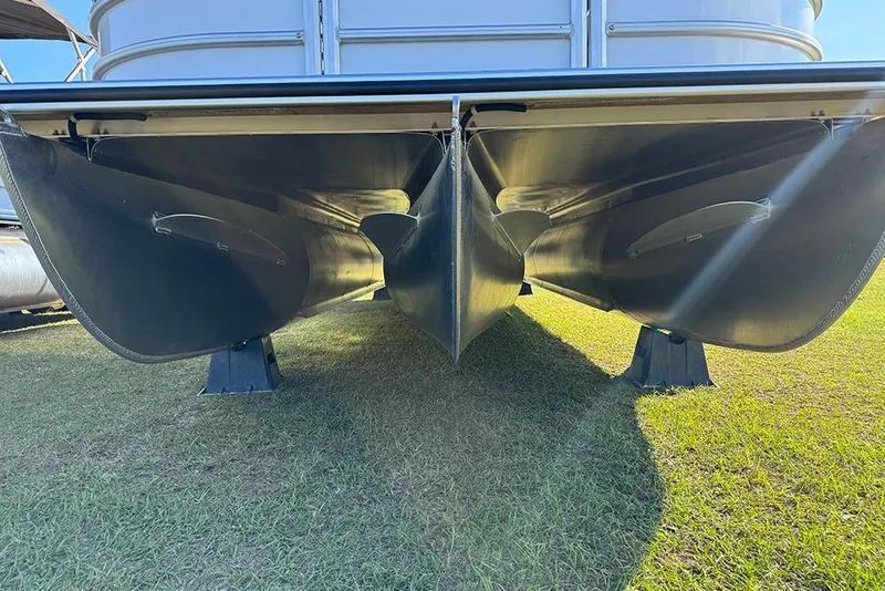 Slide: The Image of 2026 Bentley Pontoons Elite 253 Admiral pontoon boat hull on grass. - 11