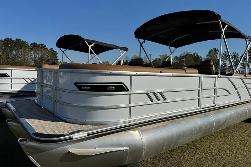 Slide: The Image of 2026 Bentley Pontoons Elite 253 Admiral, sleek design, dual canopy, luxury seating, outdoor setting. - 13