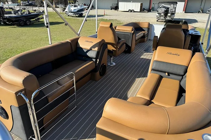 Slide: The Image of 2026 Bentley Pontoons Elite 253 Admiral with luxurious tan seating and spacious deck layout. - 14