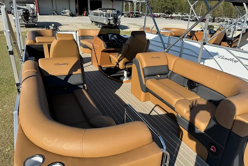 Slide: The Image of 2026 Bentley Pontoons Elite 253 Admiral with luxurious tan seating and spacious deck layout. - 15