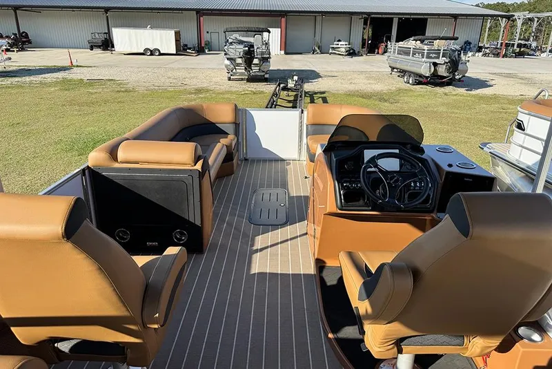 Slide: The Image of 2026 Bentley Pontoons Elite 253 Admiral interior with luxurious seating and modern dashboard. - 16
