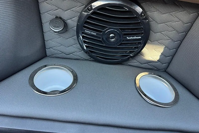 Slide: The Image of 2026 Bentley Pontoons Elite 253 Admiral interior with speaker and cup holders. - 22