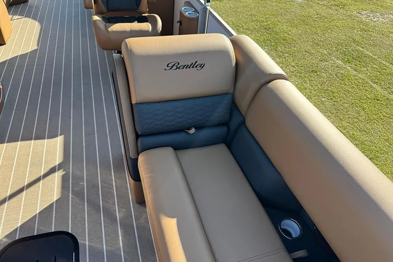 Slide: The Image of Luxurious seating on 2026 Bentley Pontoons Elite 253 Admiral, featuring elegant upholstery and cup holders. - 27