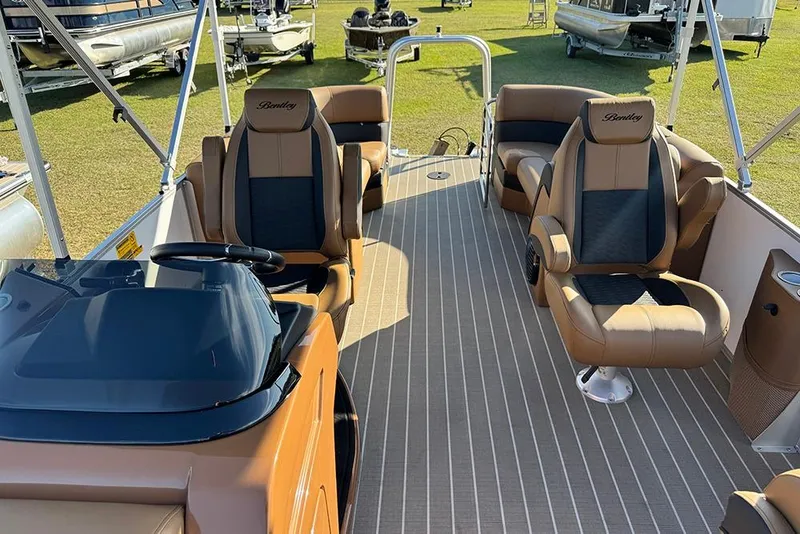 Slide: The Image of 2026 Bentley Pontoons Elite 253 Admiral interior with luxurious seating and helm. - 29