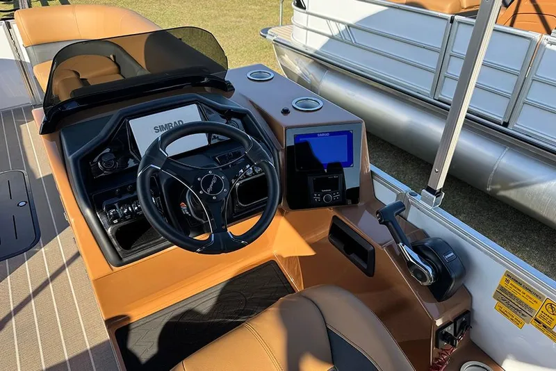 Slide: The Image of Cockpit of 2026 Bentley Pontoons Elite 253 Admiral with modern controls and steering wheel. - 34