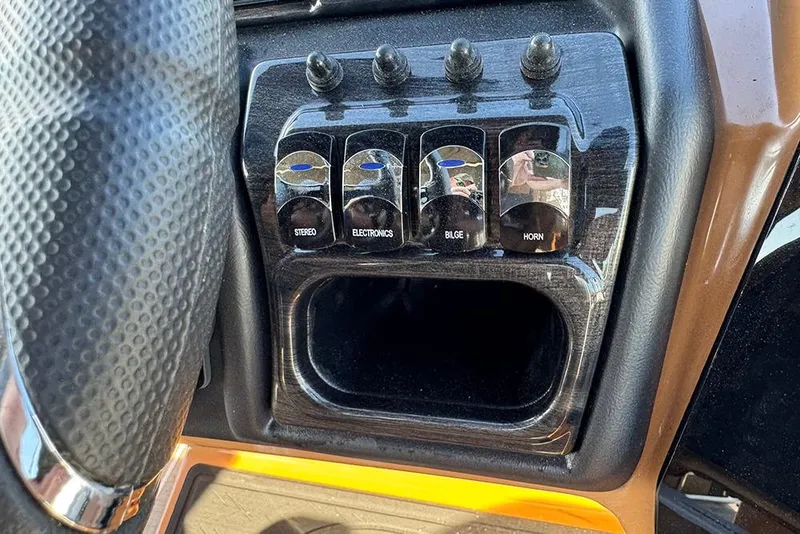 Slide: The Image of Control panel of 2026 Bentley Pontoons Elite 253 Admiral with stereo, electronics, bilge, horn switches. - 37