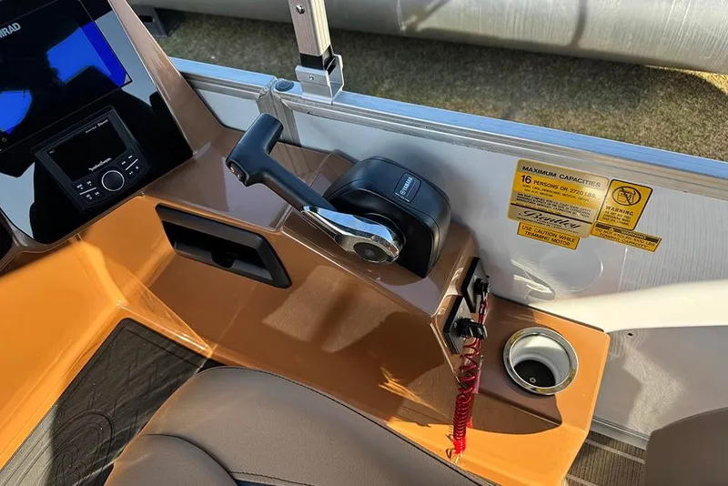 Slide: The Image of Control panel of 2026 Bentley Pontoons Elite 253 Admiral with throttle and capacity warning. - 40