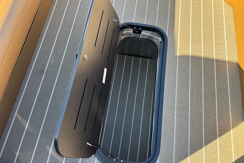 Slide: The Image of Open storage compartment on 2026 Bentley Pontoons Elite 253 Admiral boat deck. - 44