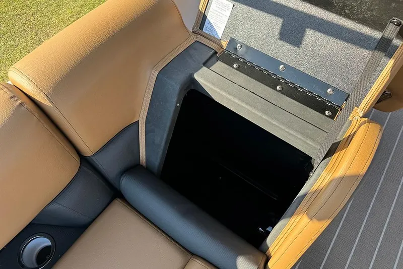 Slide: The Image of 2026 Bentley Pontoons Elite 253 Admiral seat storage compartment, tan and black upholstery. - 51