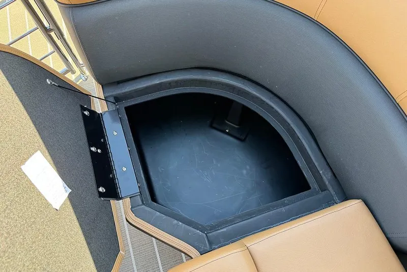 Slide: The Image of Storage compartment in 2026 Bentley Pontoons Elite 253 Admiral boat, featuring tan upholstery. - 53
