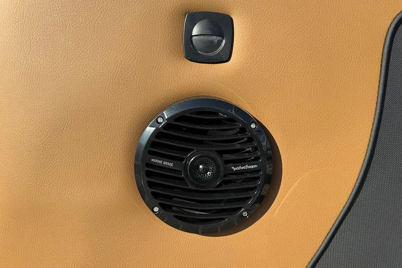Slide: The Image of Marine-grade speaker on Bentley Pontoons Elite 253 Admiral, 2026 model, with tan upholstery. - 57