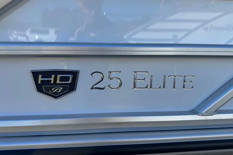Slide: The Image of 2026 Bentley Pontoons Elite 253 Admiral logo and model name on boat exterior. - 7