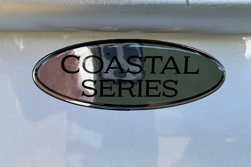 Slide: The Image of "Coastal Series" emblem on 2026 Bentley Pontoons Elite 253 Admiral. - 8