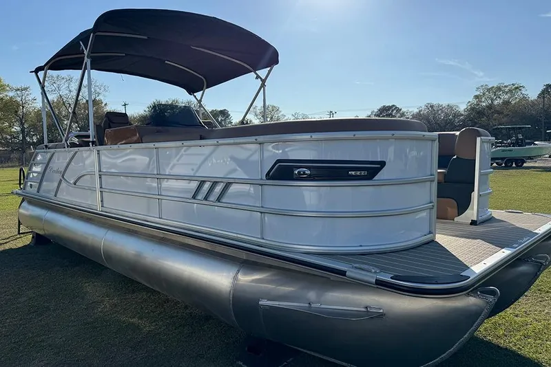 Slide: The Image of 2026 Bentley Pontoons Elite 253 Admiral pontoon boat with canopy on grassy area. - 9