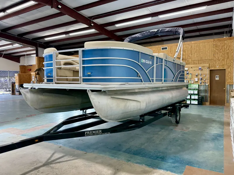 Slide: The Image of 2017 Sylvan 8520 pontoon boat in warehouse on trailer. - 6