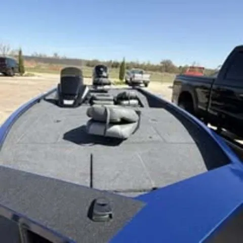 Slide: The Image of 2025 Lowe Stinger 195C boat on parking lot, front view. - 4