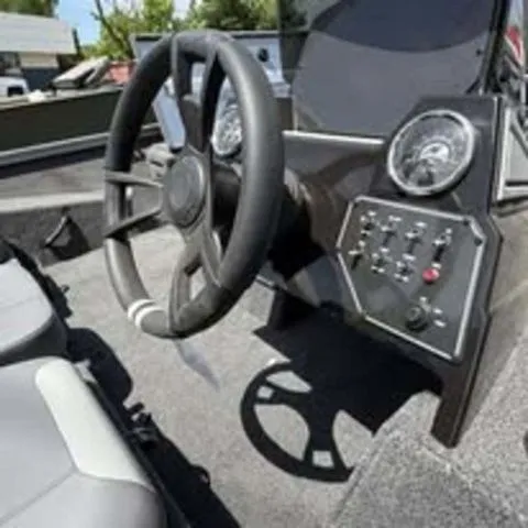 Slide: The Image of Interior view of 2025 Lowe Stinger 195C boat cockpit. - 5