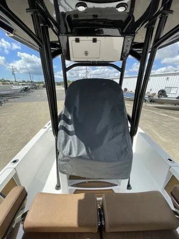 Slide: The Image of 2023 Sea Pro 248 Bay Series boat with cover and seating area. - 10