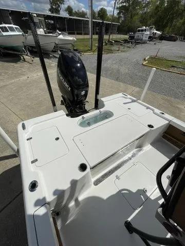 Slide: The Image of 2023 Sea Pro 248 Bay Series boat stern view at marina. - 16