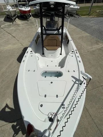 Slide: The Image of 2023 Sea Pro 248 Bay Series boat on a concrete lot. - 23