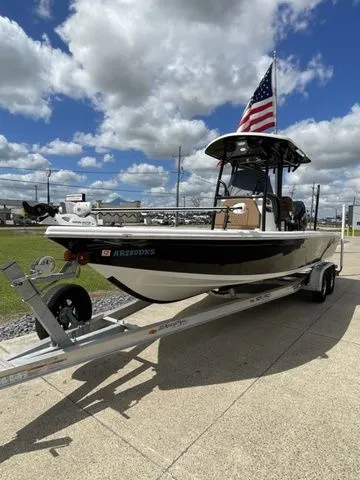Slide: The Image of 2023 Sea Pro 248 Bay Series boat on trailer with US flag. - 6