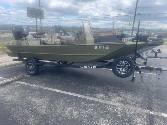 The Image of 2024 Lowe Roughneck RX1760 Pathfinder parked on trailer outdoors. - 1