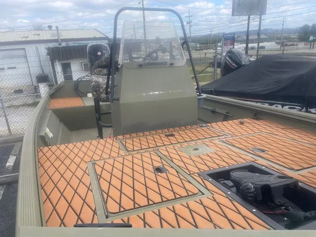 Slide: The Image of 2024 Lowe Roughneck RX1760 Pathfinder boat with center console and wooden deck. - 3