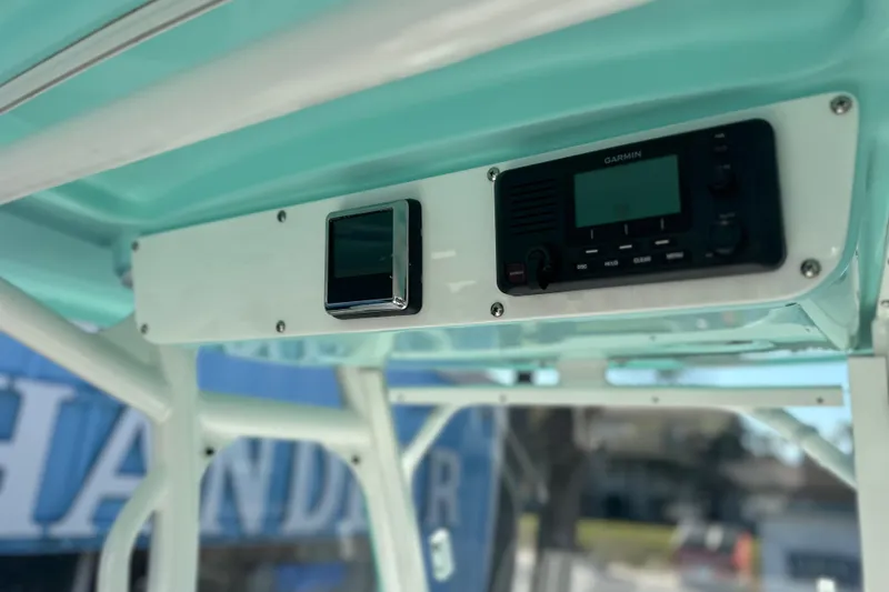 Slide: The Image of 2020 Everglades 243 Center Console boat with Garmin electronics on teal interior. - 11