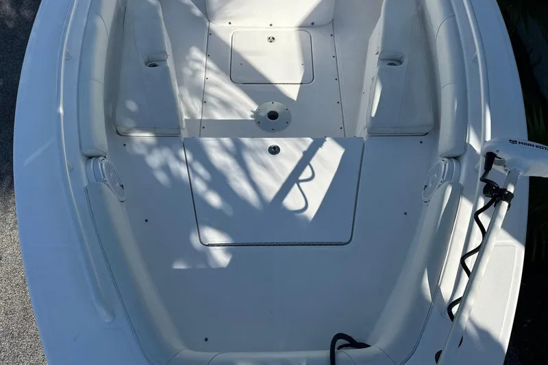 Slide: The Image of 2020 Everglades 243 Center Console boat interior with seating and storage compartments. - 13