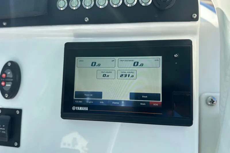 Slide: The Image of Yamaha display on 2020 Everglades 243 Center Console showing trip and total hours. - 23