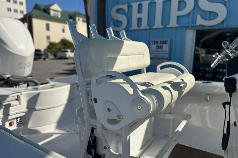 Slide: The Image of 2020 Everglades 243 Center Console boat interior with white seating and controls. - 5