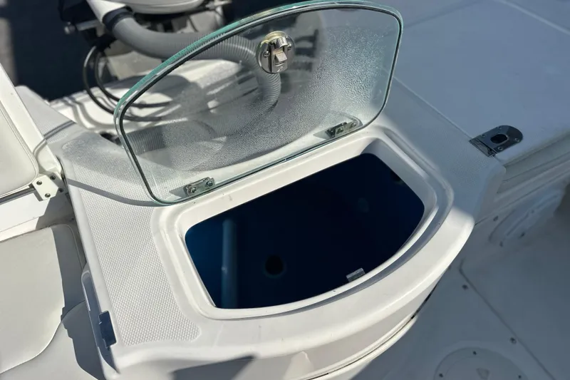 Slide: The Image of Open storage compartment on 2020 Everglades 243 Center Console boat. - 6