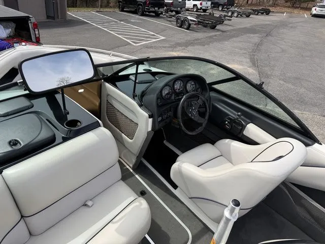 Slide: The Image of Interior of a 2000 Malibu Sunsetter LXi boat with white upholstery. - 5