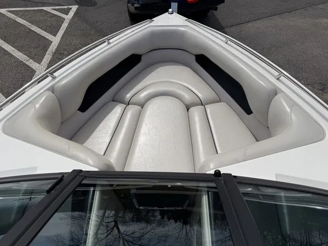 Slide: The Image of Interior view of a 2000 Malibu Sunsetter LXi boat with white seating. - 7