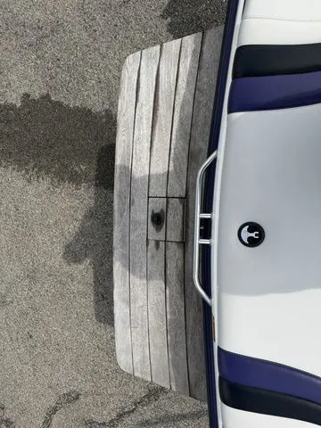 Slide: The Image of Malibu Sunsetter LXi 2000 with wooden platform and white seat. - 8