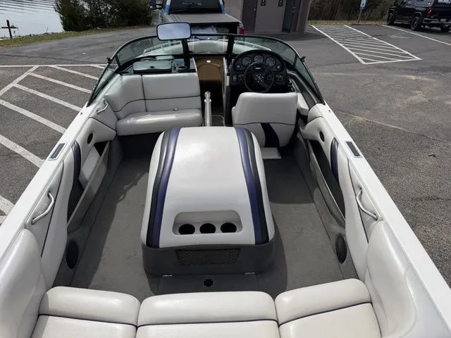 Slide: The Image of Interior of a 2000 Malibu Sunsetter LXi boat with white seating. - 9