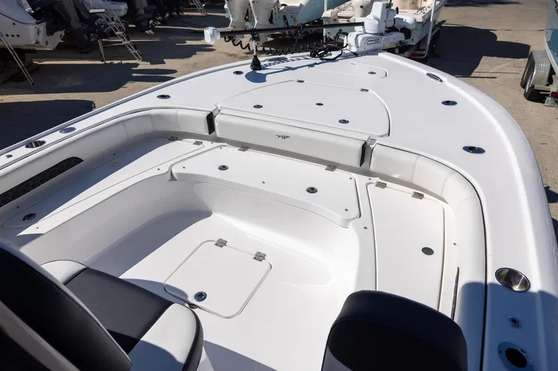 Slide: The Image of 2025 Tidewater 2500 Carolina Bay boat interior with spacious seating and storage compartments. - 11