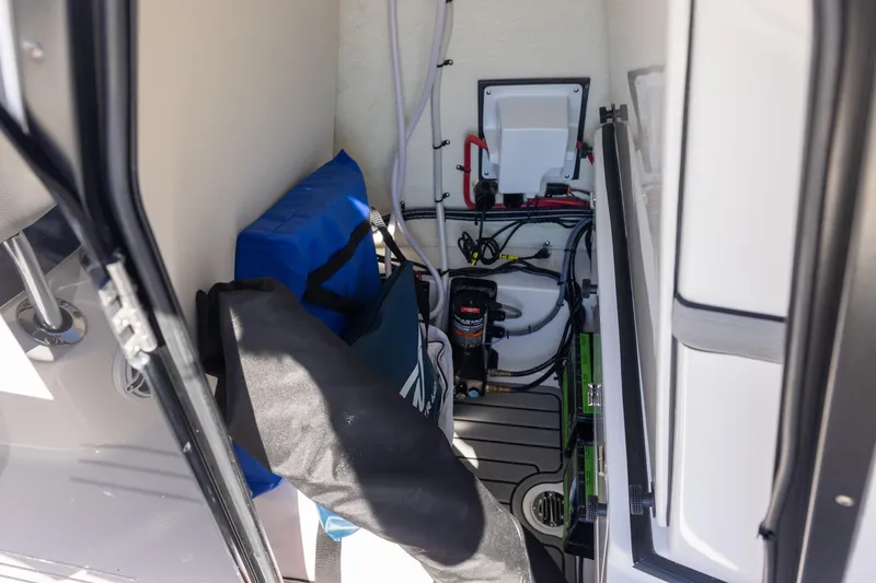 Slide: The Image of Interior view of 2025 Tidewater 2500 Carolina Bay boat storage compartment. - 12