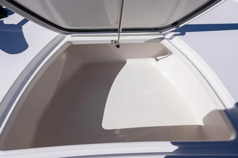 Slide: The Image of Open storage compartment on 2025 Tidewater 2500 Carolina Bay boat. - 16