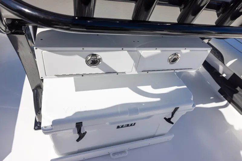 Slide: The Image of Storage compartment and cooler on 2025 Tidewater 2500 Carolina Bay boat. - 18