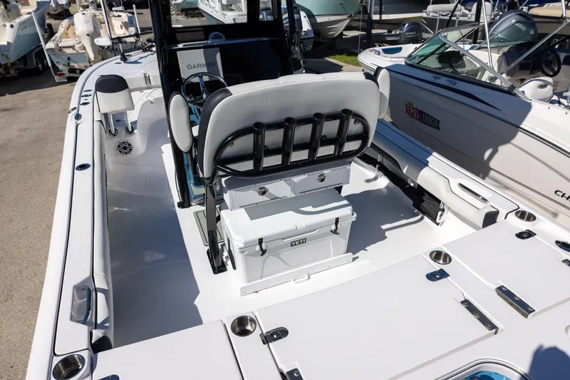 Slide: The Image of 2025 Tidewater 2500 Carolina Bay boat interior with seating and Yeti cooler. - 5