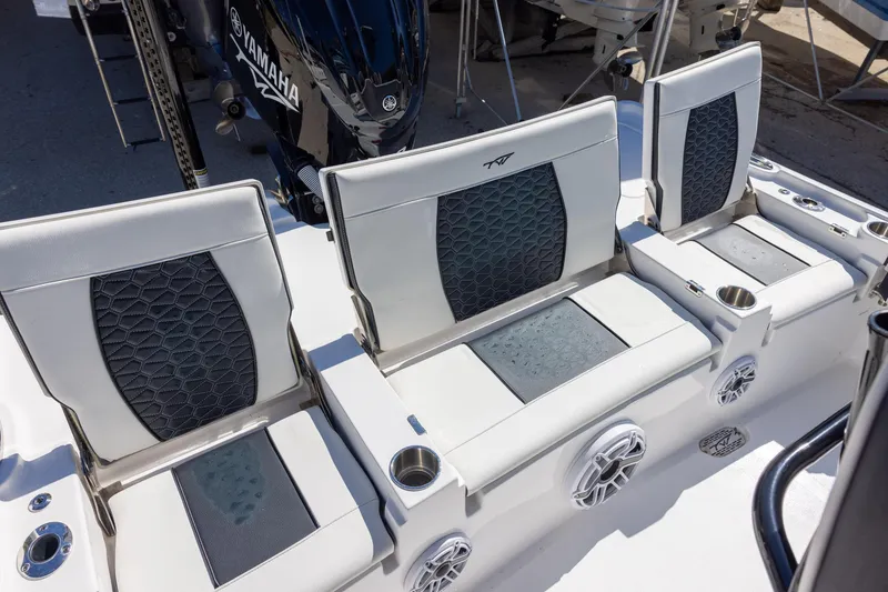 Slide: The Image of 2025 Tidewater 2500 Carolina Bay boat seats with Yamaha engine in background. - 6