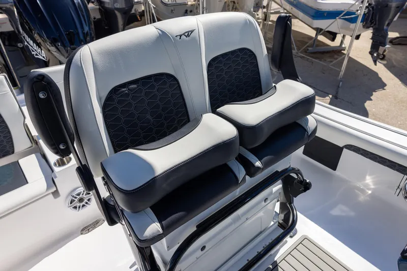 Slide: The Image of 2025 Tidewater 2500 Carolina Bay boat seating with modern design and comfortable cushions. - 7