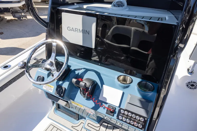Slide: The Image of 2025 Tidewater 2500 Carolina Bay boat console with Garmin navigation system. - 9